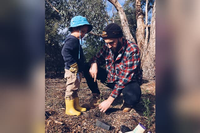 Father showing how to plant