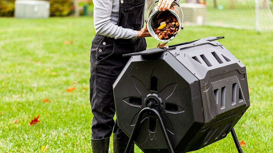 loading biodegradables to compost tumbler bin